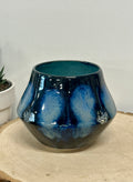 Small black, blue, and white dotted vase