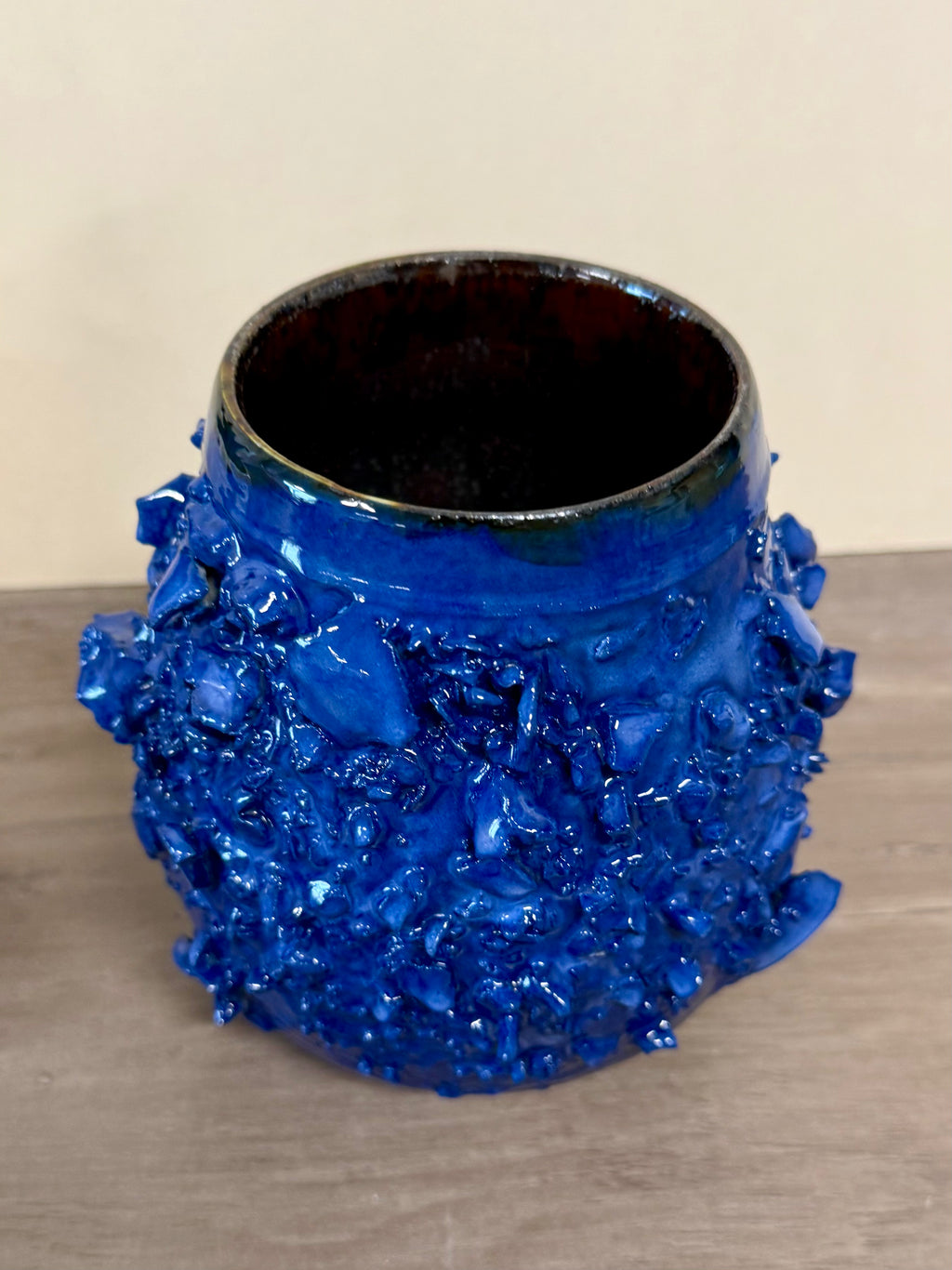 Rocky textured thrown blue vessel