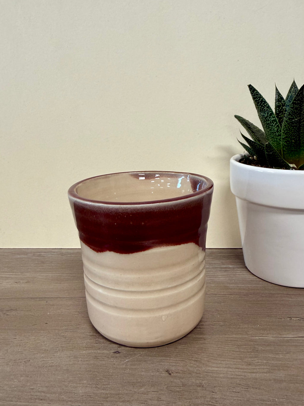 Wheel thrown pink and maroon cup