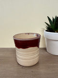 Wheel thrown pink and maroon cup