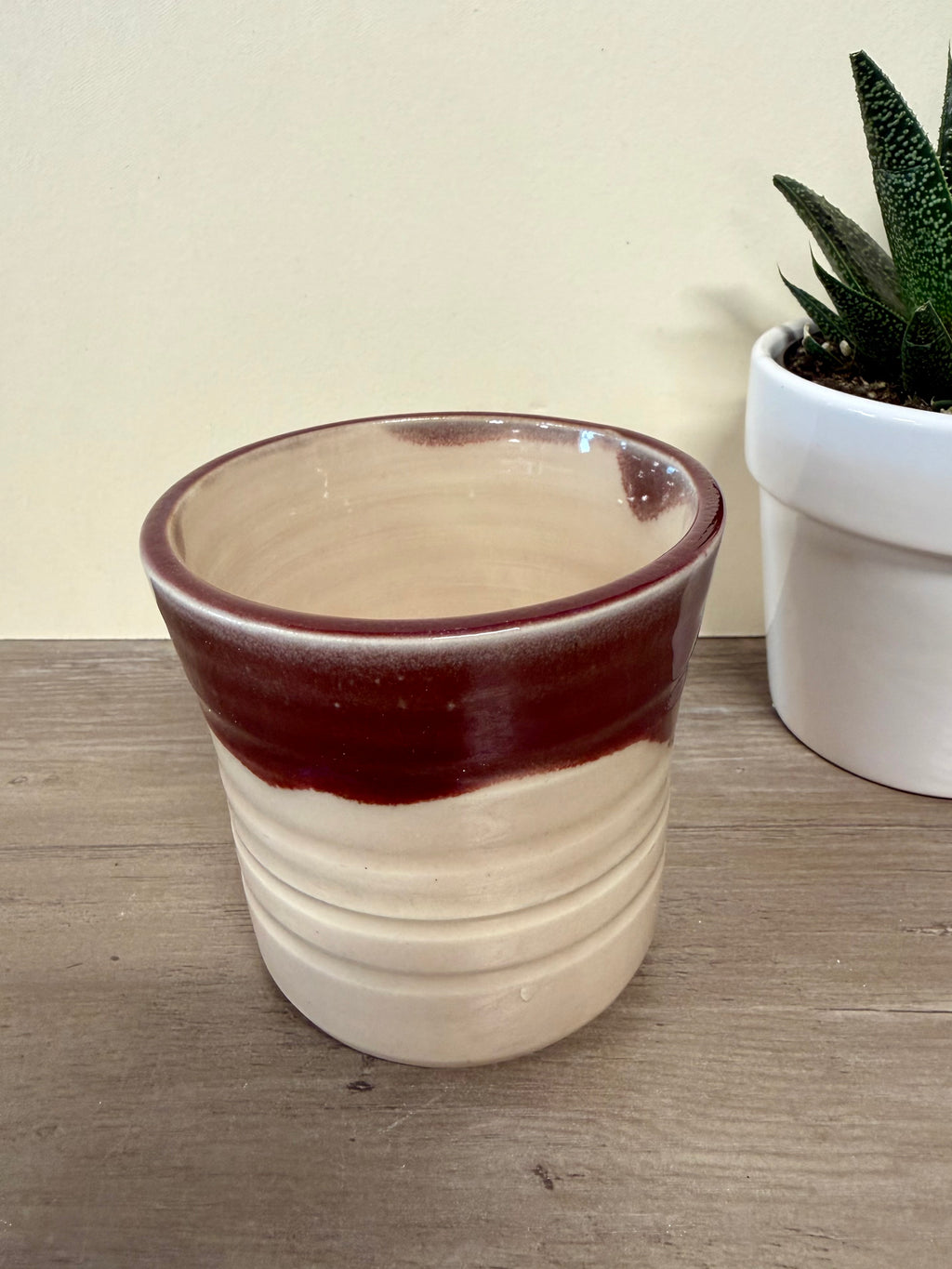Wheel thrown pink and maroon cup