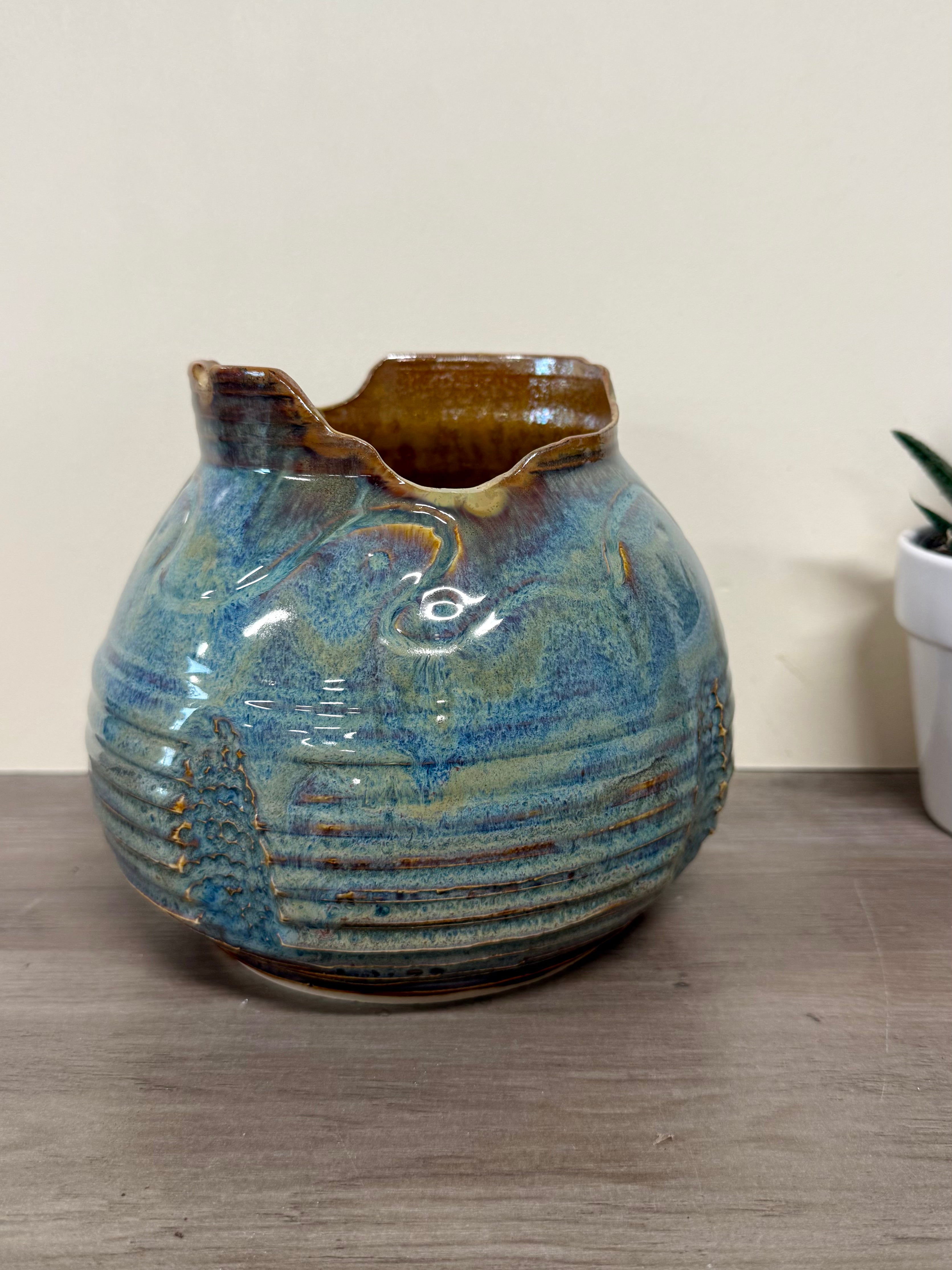 Thrown and carved round vase
