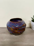 Twisted purple and brown vessel