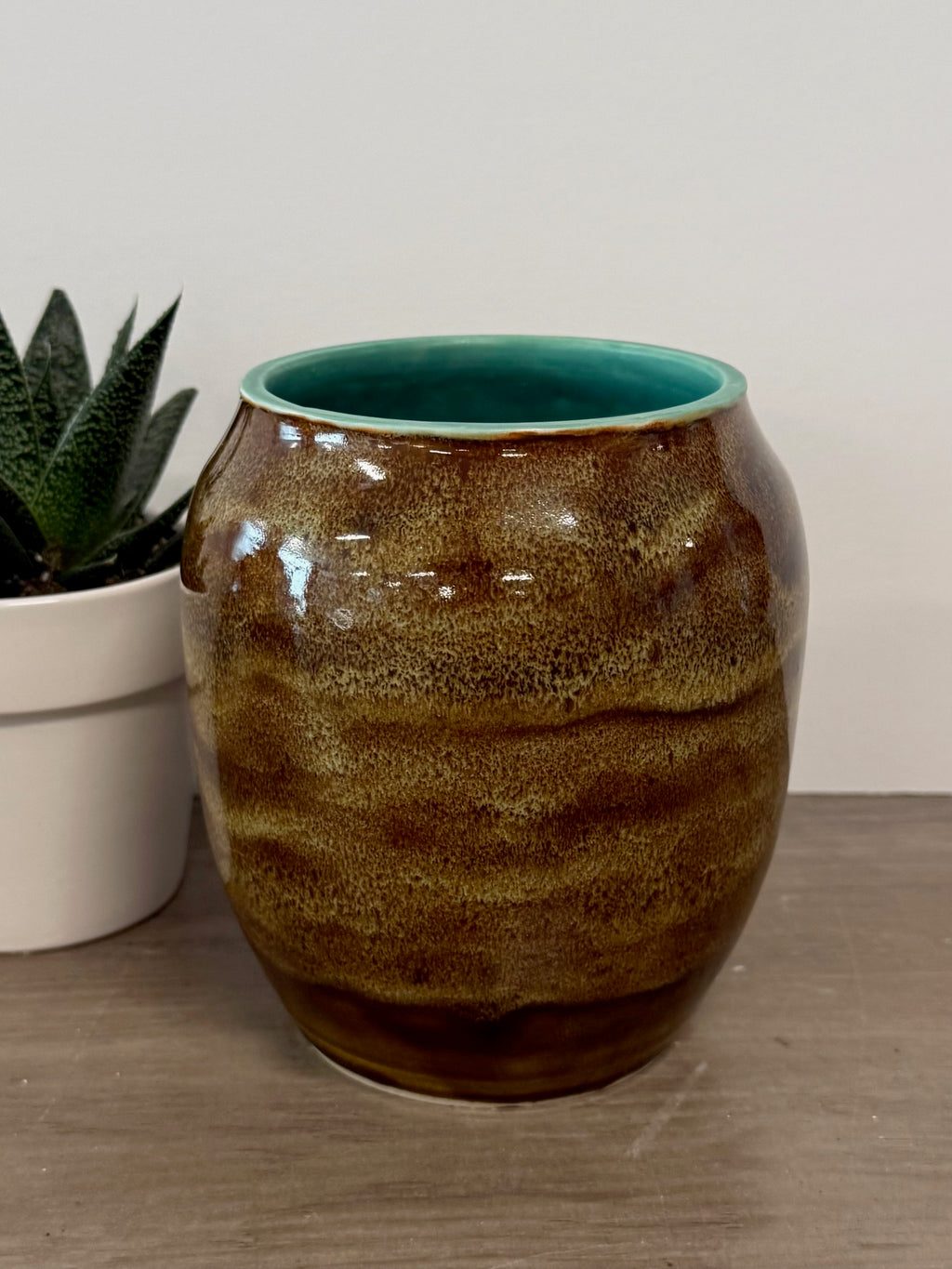 Thrown vase with speckled brown glaze