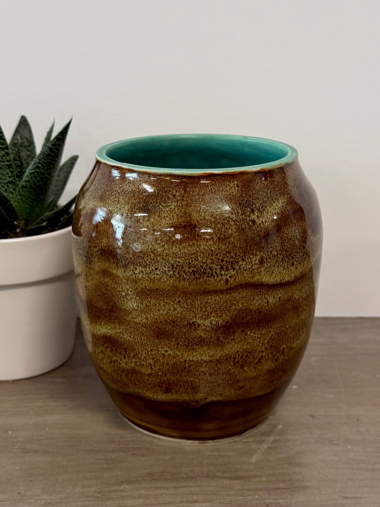 Thrown vase with speckled brown glaze